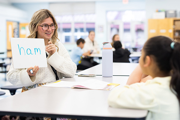 Education students roll up their sleeves for literacy in local public school classrooms